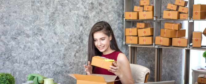 A small business owner packaging products for online sales, representing e-commerce sellers preparing for new U.S. import rules after the de-minimis policy ends in 2025.